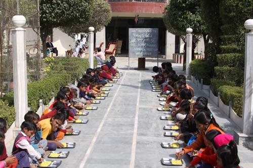 Children eating at the Ashram