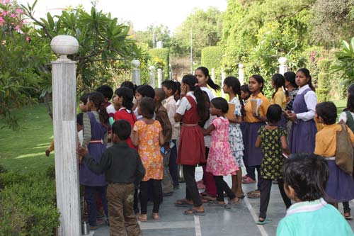 Children excitedly watching out for the monkey