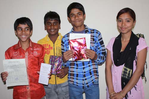Aman, Goldy, Rahul and their class teacher Varsha Gupta