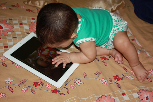 Apra playing with the iPad