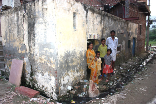 Sanju and his family in front of their home
