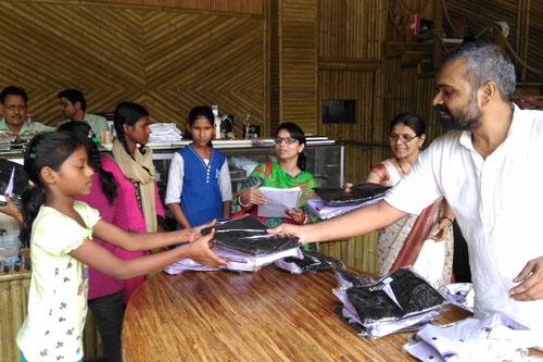 Yashendu handing out Uniforms