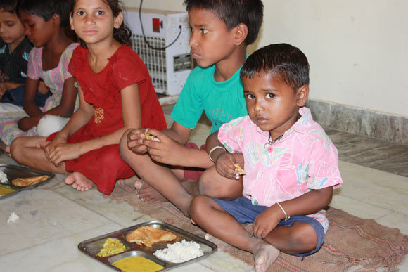 Children eating in India